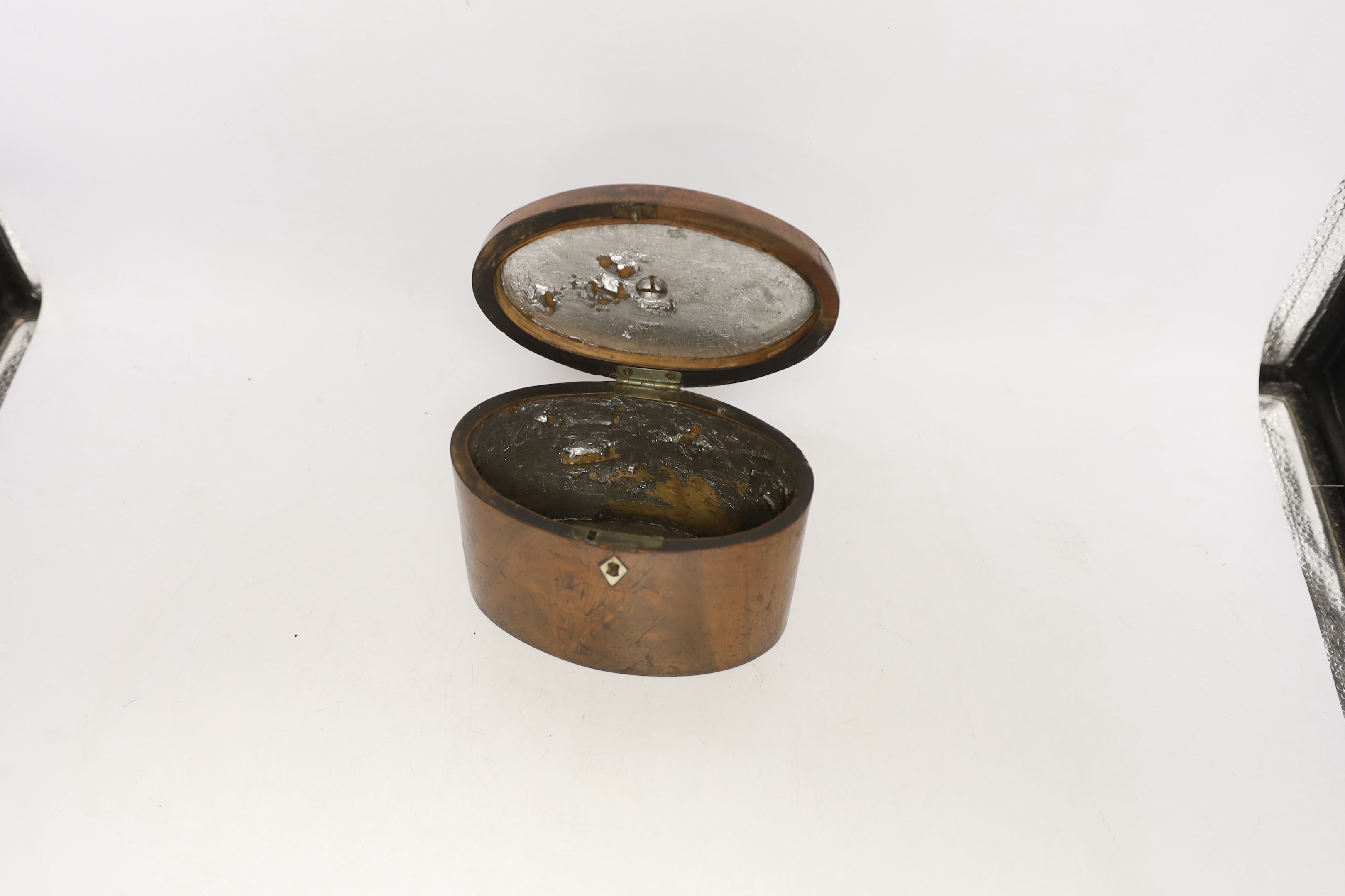 A George III oval mahogany tea caddy with bone lock escutcheon, 12cm high